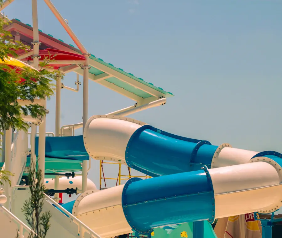 Blue and white twisting water slides beneath a clear sky — reference photograph
